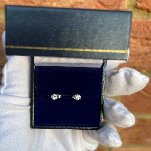 Stud diamond earrings in a small jewellery box