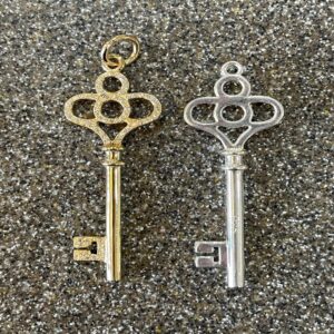 2 key shaped pendents