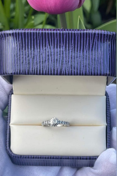 Silver ring in purple box